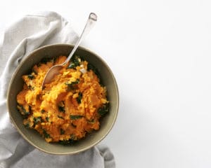 Garlicky sweet potato and kale mash, great for a holiday meal.