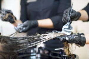 Woman getting hair dyed.
