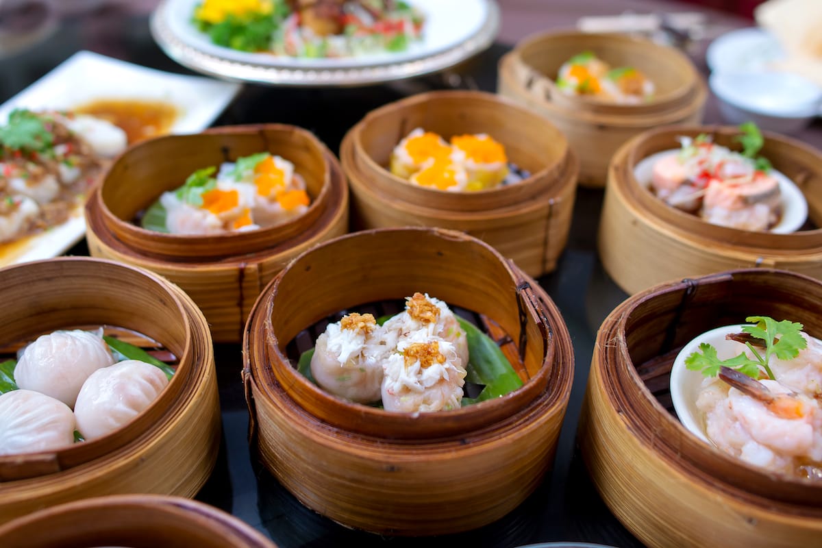 yumcha, various Asian steamed dumplings in bamboo steamer in Chinese restaurant