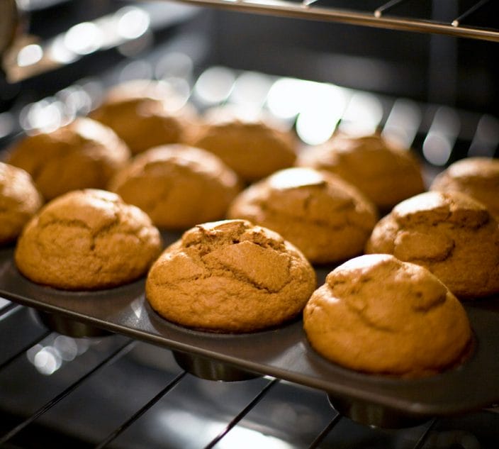 Baked pumpkin muffins just coming out of the oven