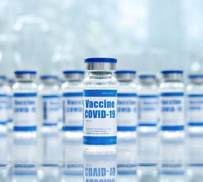 Covid 19 corona virus vaccine vial bottles for intramuscular injections on medical pharmaceutical industry background. Coronavirus cure manufacture, flu treatment drug pharmacy production concept.