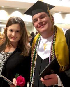 Trevor Gartman with his mom at his high school graduation.